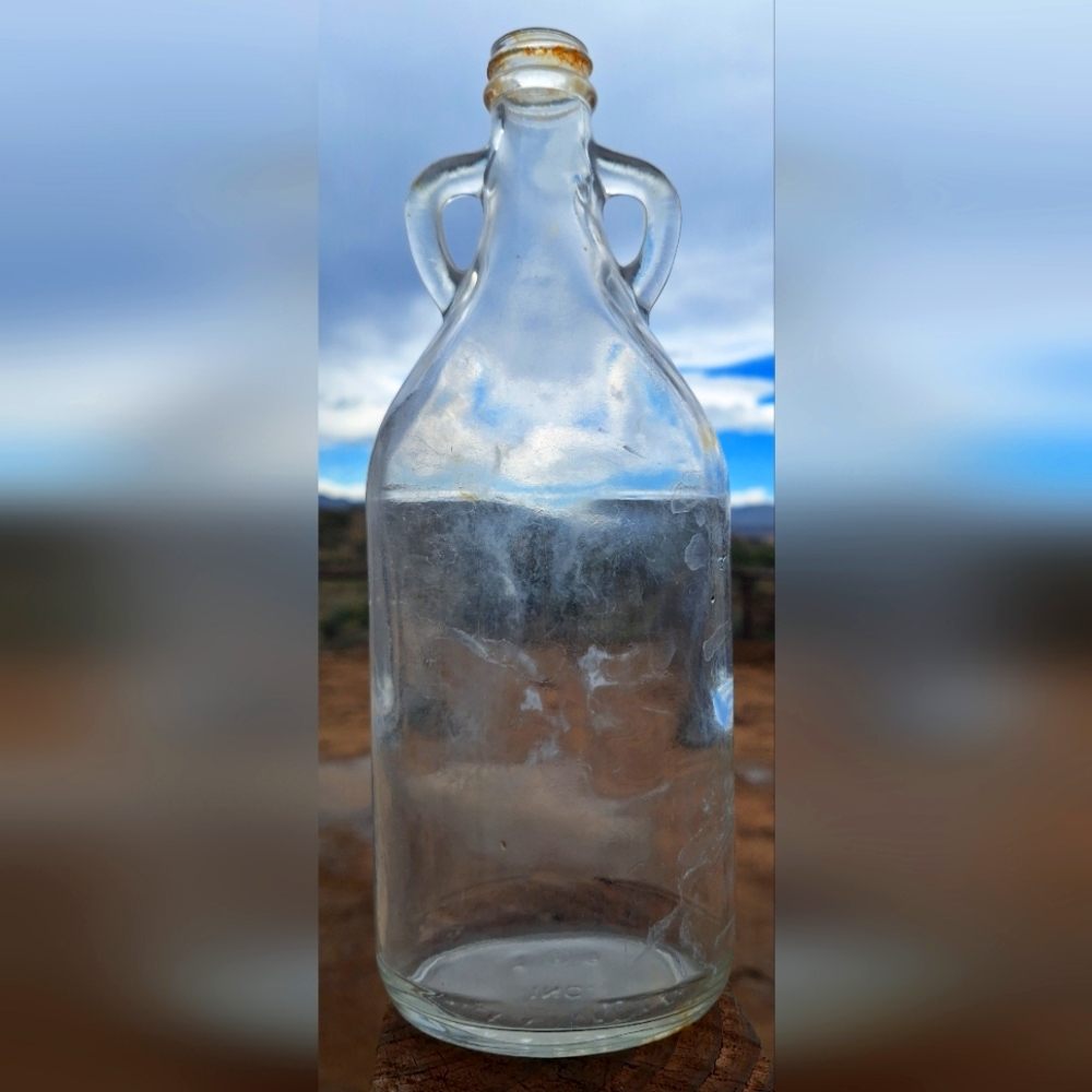 1940's PENICK & FORD LTD. clear glass bottle with handles. 10" tall